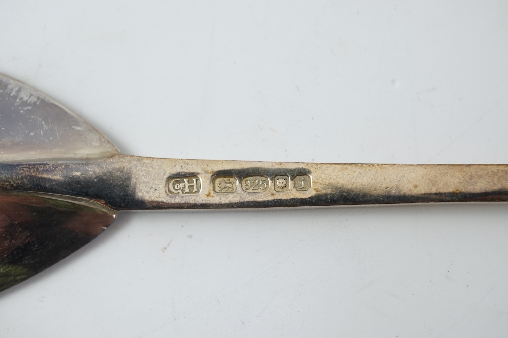 A pair of Elizabeth II silver 'seal top' spoons by The Guild of Handicrafts, London, 1990, 16cm, together with a similar later spoon, London, 2008 and a similar preserve spoon, London, 2003, two with boxes.